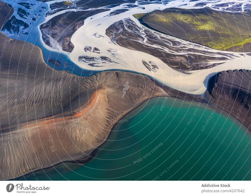 Scenic view of blue pond surrounded by rocky formations lake mountain scenery range wonderful nature ridge highland iceland environment reservoir landscape