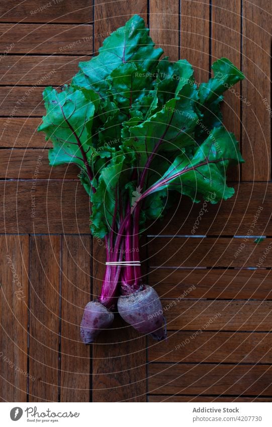 Bunch of fresh beet on black table bunch vegetable ripe harvest vitamin food healthy organic natural edible nutrition shabby weathered grunge vegetarian raw