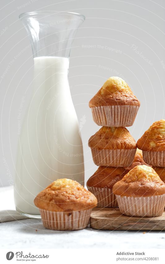 Sweet muffins and jar of milk pastry homemade sweet fresh breakfast baked dessert food yummy tasty appetizing cuisine gastronomy treat meal culinary product