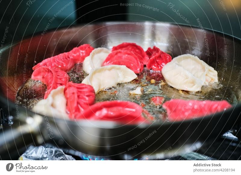 Saucepan in Kitchen Closeup closeup close up preparation cooking saucepan oil restaurant food meal japanese food asian kitchen cuisine delicious hot dish vector