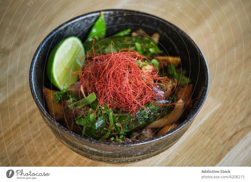 Detail of Yummy Japanese Bowl top view yummy delicious japanese restaurant colorful healthy meal bowl food rice vegetables vegetarian wooden table prepared