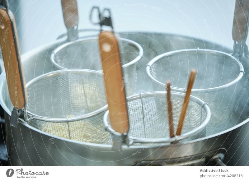 Boiling Casserole With Noodles noodles preparing preparation noodles strainers top view cooking restaurant japanese restaurant japanese food kitchen casseroles