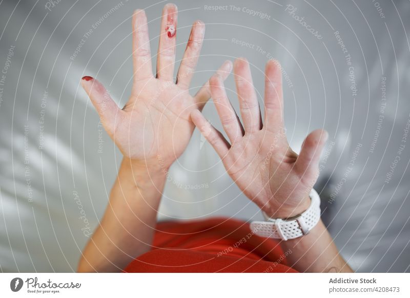 Crop woman showing hands in chalk demonstrate training blood prepare athlete gym physical female pain alpinism healthy sport strength vitality strong wellness