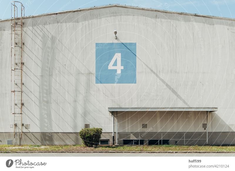 Warehouse number 4 with shade and covered basement entrance Ladder Rung Escape route shadow cast waiting zone 50s Harbour Logistics logistics Hall Flake Storage