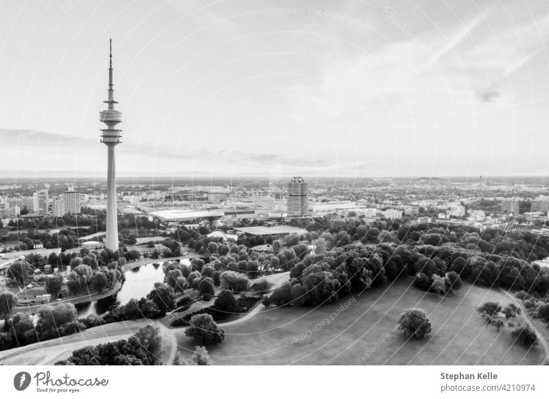 Aerial view over the beautiful bavarian town Munich, monaco, with its popular tourism hotspot at the Olympic park and its the high tower at a bright day. sun