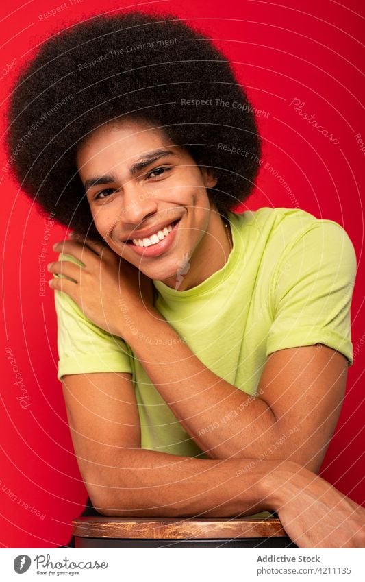 Happy black man with Afro hairstyle individuality afro conceited cool millennial portrait arrogant african american ethnic self confident contemporary