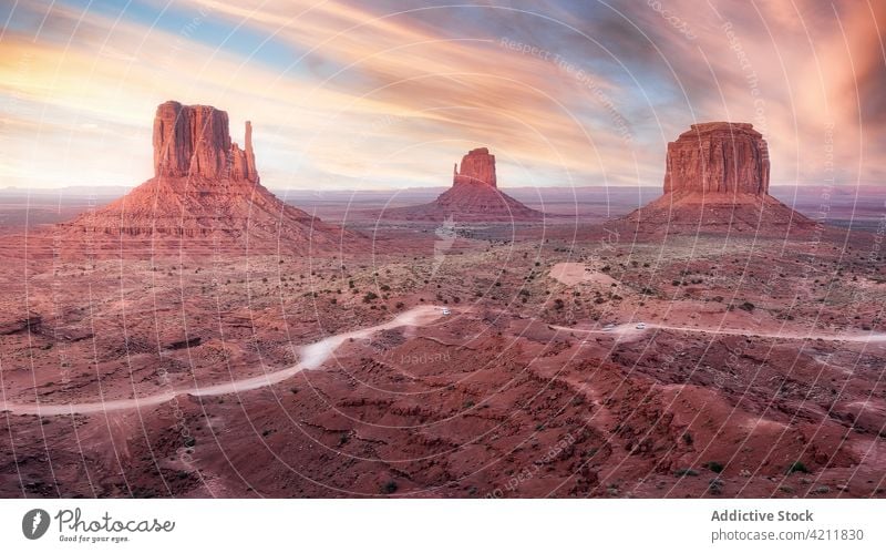 Picturesque landscape with rocky formations under colorful sky valley nature environment picturesque scenery monument valley america usa spectacular terrain