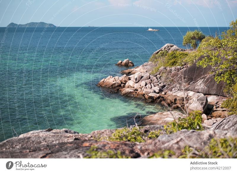 Scenic view of rocky coast near blue sea in summer scenery seascape sunny shore landscape coastline thailand water picturesque ocean peaceful stone scenic calm