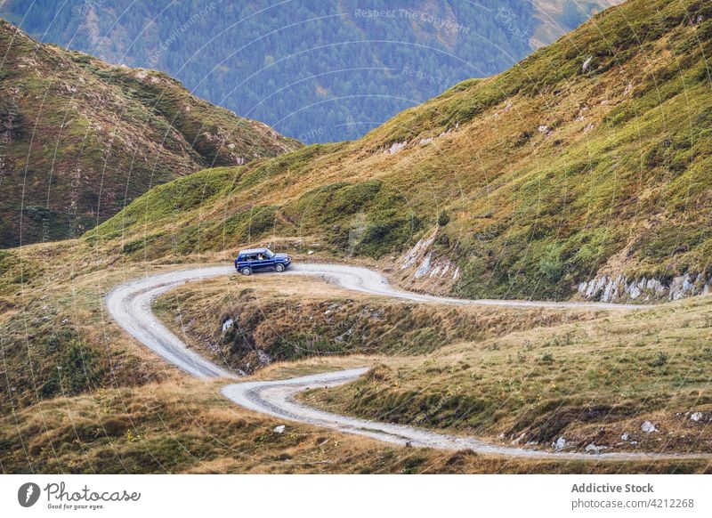 Car driving on road in highlands car road trip travel hill nature drive pyrenees countryside transport mountain tourism modern dusty forest daylight spain