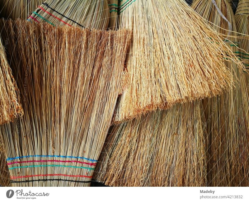 Traditional handmade brooms at a bazaar in Adapazari in the province of Sakarya in Turkey Broom sweeper straw broom Handcrafts Sweep polish Cleaning Straw