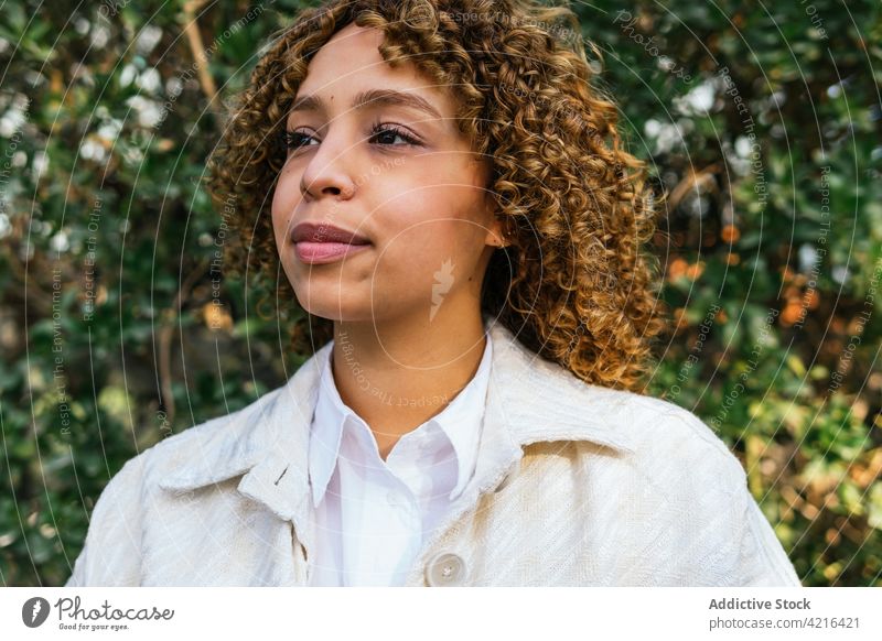 Carefree black woman enjoying summer in garden dreamy park carefree nature smile tranquil tender female ethnic african american cheerful green peaceful calm