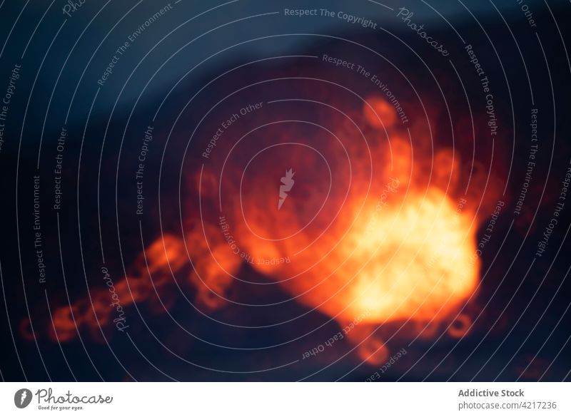 Blur close-up magma sparks out of the volcano hole in Iceland Fagradalsfjall iceland lava blur smoke mountain red hot nature volcanic eruption crater active