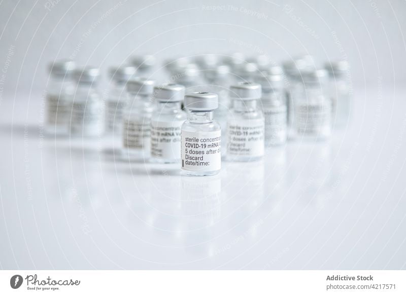 Close-up of some vials with the coronavirus vaccine on a white background Vial isolated ampoule bottle medical health medicine treatment pharmacy care