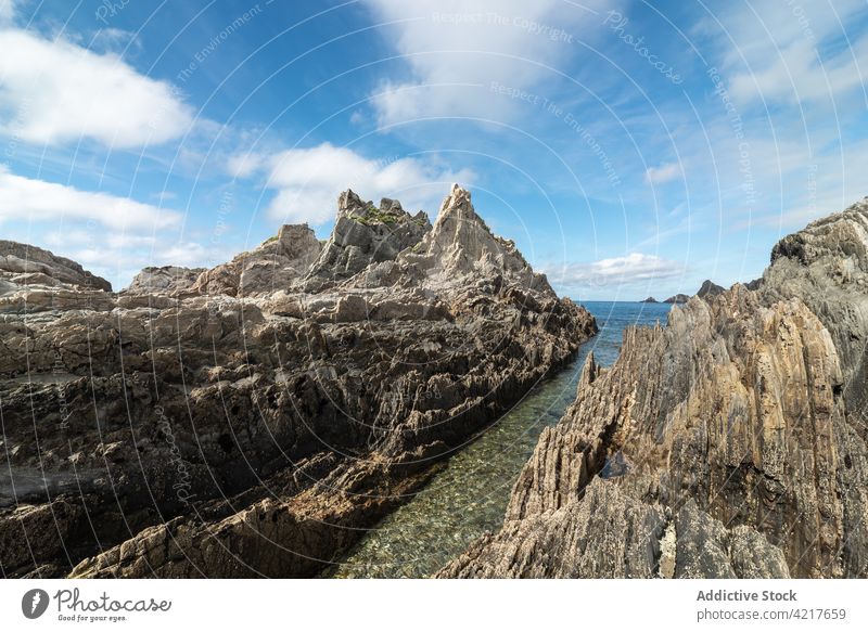 Majestic view of rocky seashore beach formation stone rough coast picturesque asturias spain gueirua beach coastline scenic landscape scenery water sky peaceful