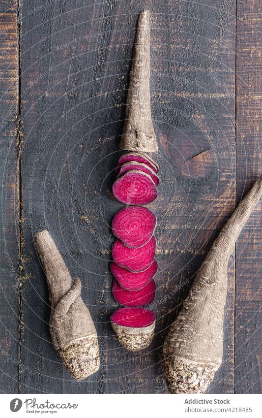 Ripe beetroot cut into slices on wooden table vegetable organic ripe ingredient composition product cook harvest grocery raw nutrition vegetarian vegan rustic