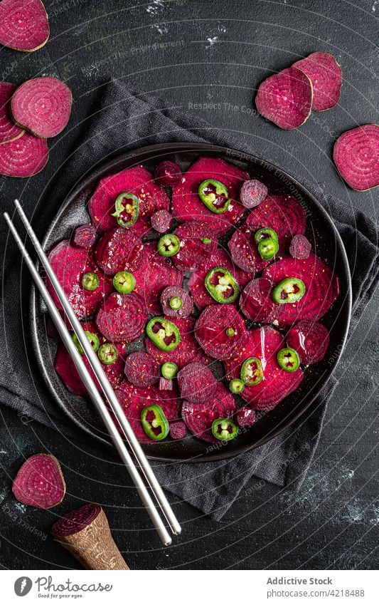 Sweet beetroot slices heaped on baking pan vegetable chopsticks cut cook process bake jalapeno appetizing salad ripe ingredient recipe chili organic cuisine