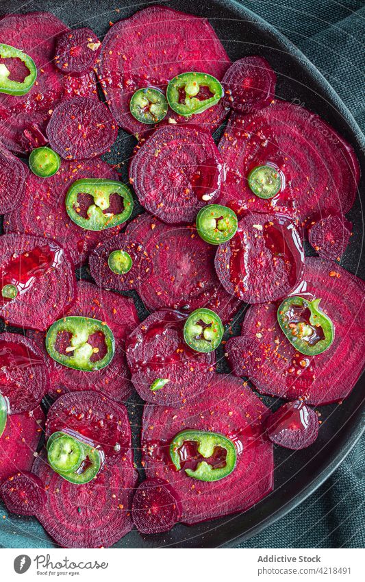 Sweet beetroot slices heaped on baking pan vegetable cut cook process bake jalapeno appetizing salad ripe ingredient recipe chili organic cuisine tasty raw