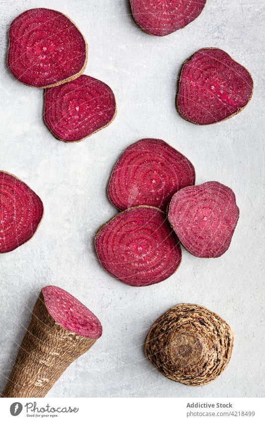 Ripe beetroot cut into slices on white table vegetable organic ripe ingredient composition product cook harvest grocery raw nutrition vegetarian vegan rustic