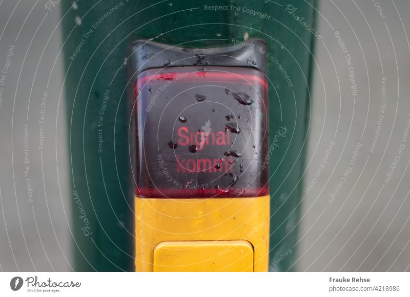 "Signal coming" button on a pedestrian traffic light. Pedestrian traffic light Traverse Transport Traffic light Road sign Wait Road traffic Town Street Safety