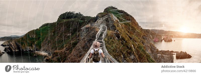 Traveling man standing mountain cliff admiring view travel summer male spain holiday ocean trip tourism coast shore caceres traveler admire seascape rocky hill