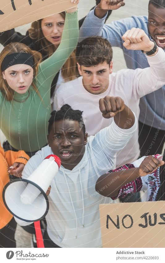 Company of diverse people protesting with posters on street black lives matter demonstrate crowd shout together racism discriminate multiracial blm multiethnic