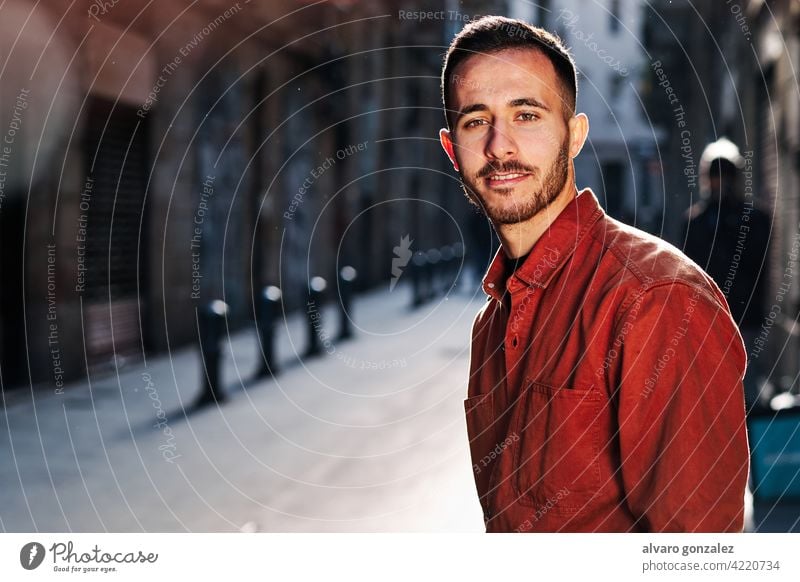 Man standing outdoors on the street. che portrait urban city confidence people one face serious posing town looking outside confident style person male