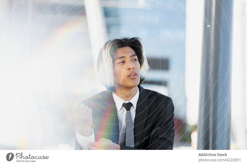 Stylish Asian businessman in suit touching cuff style formal gentleman self employed intelligent modern professional portrait executive independent urban