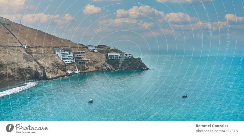 Aerial view of the bay, marina and buildings of Ancon - Lima, Peru; The beach and some exterior buildings in Ancon. sky peru ocean lima ancon pacific turquoise