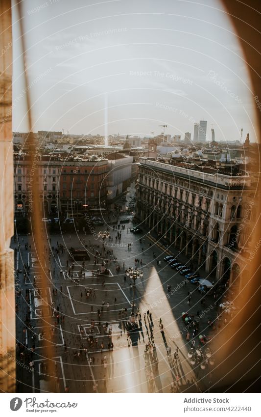 Old masonry house facades and city square with unrecognizable people architecture historic heritage old sky hole pavement culture tradition milan italy europe