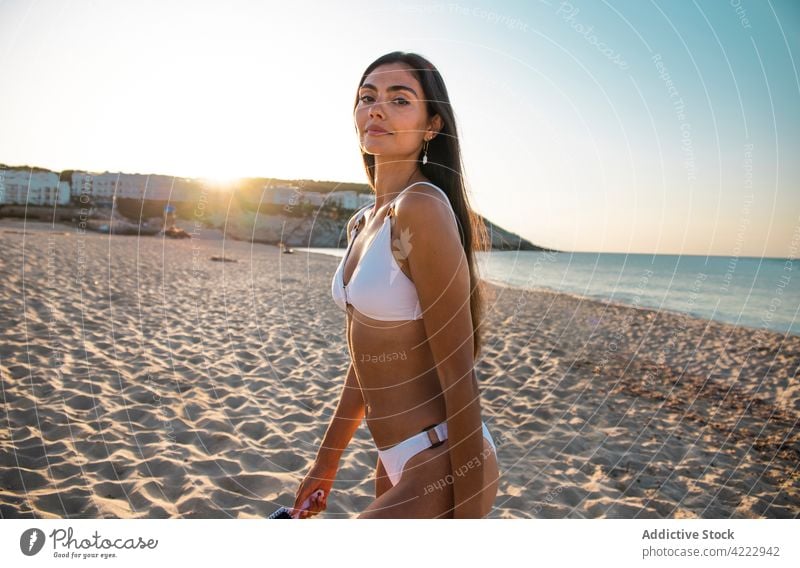 Woman in swimsuit against ocean with mountain woman feminine body gentle nature sky portrait sea swimwear summer highland wavy horizon seascape endless slope