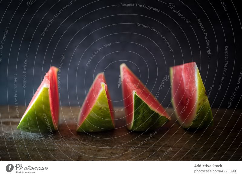 Bright fresh watermelon pieces on gray background slice berry ripe vitamin healthy food tasty juicy natural row organic peel sweet scent aroma tender ingredient