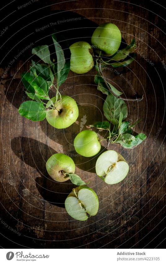 Fresh apple with leaves on table fruit vitamin fresh ripe natural foliage juicy healthy food organic leaf ingredient edible product delicious pedicel stalk