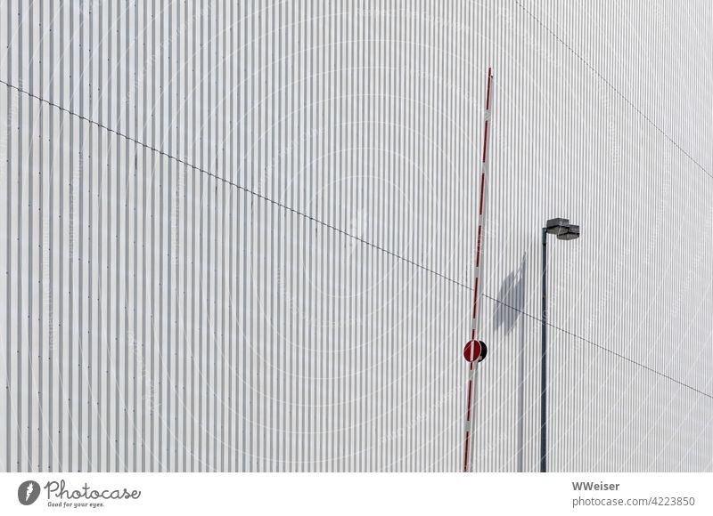 Barrier and lantern on the wall of a large factory hall Works Factory Warehouse Storage urban Production Shadow Lantern Transport Control barrier Open Fine