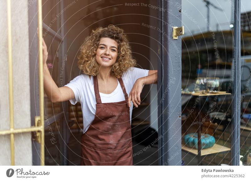 Portrait of woman pottery artist in art studio ceramics work working people young adult casual attractive female happy Caucasian enjoying one person beautiful