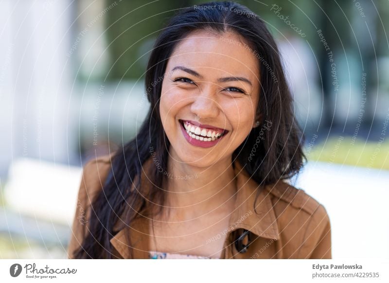 Portrait of beautiful young woman in urban area Filipino street city active people young adult casual attractive female happy asian enjoying one person