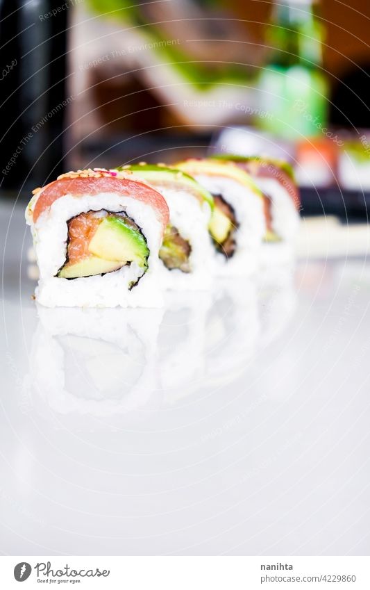 Delicious variety of sushi california rolls food asian gourmet fusion fusion food japanese japanese food fish raw rice maki salmon tuna avocado take away