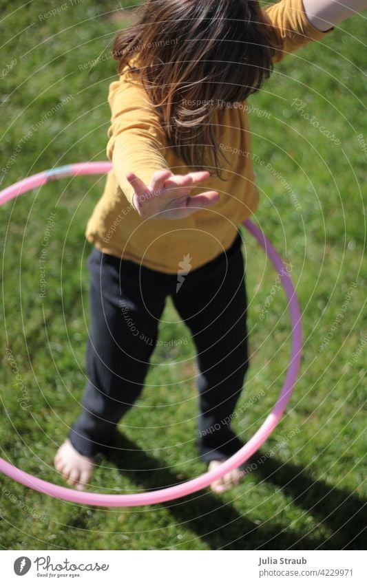 Hands up in the hula hoop Girl Infancy Child Nursery school child Kindergarten Playing being out Hula hoop Hands up! yeah turns Circle circling Round Pink