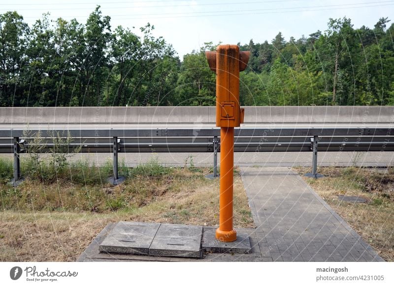 Emergency call box on the motorway emergency telephone Highway Road traffic Telephone Traffic infrastructure Exterior shot Deserted nobody Motoring Street Car