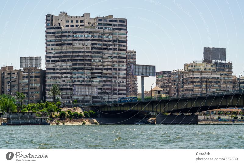 slum houses of Cairo on the banks of the Nile in Egypt adventure air conditioner architecture beggar blue boat bridge building bus cairo capital city cityscape