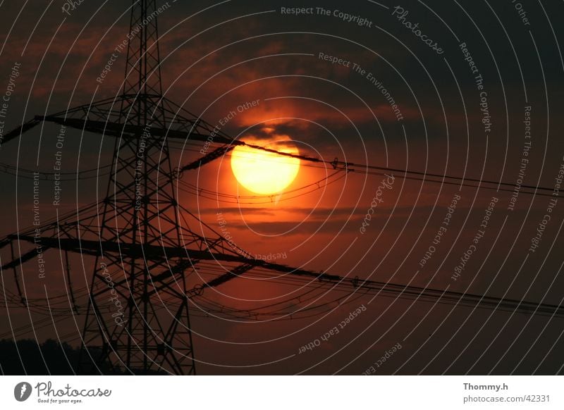 Energy in the double sense Electricity Sunset energy Electricity pylon Evening