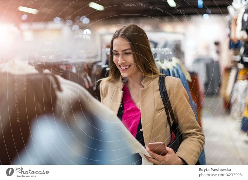 Portrait of young woman in shopping mall enjoying lifestyle adult people one person casual caucasian positive carefree standing happy smile smiling female