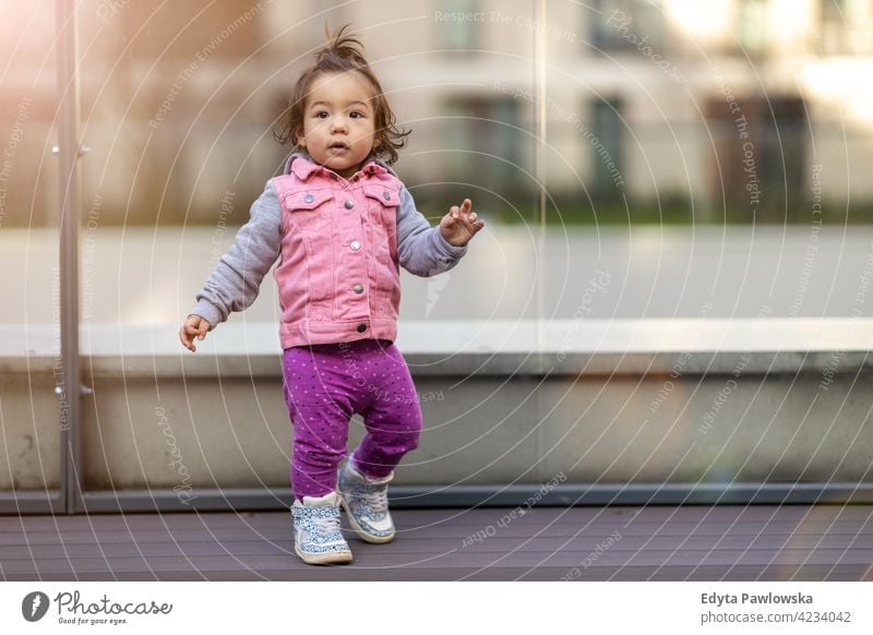 Little girl outdoors asian Vietnamese baby kid infant adorable beautiful child childcare childhood expression face cute little small tranquil together mother