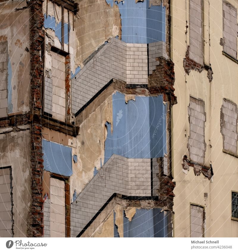 Remaining and bricked up parts of an old house left leftover be left house facade Facade Termination condemned house Gloomy Sadness Transience