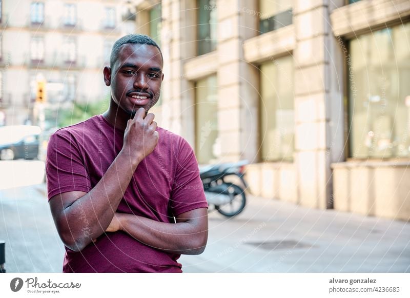 young african american model looking directly to camera male black adult portrait handsome casual attractive che person expression people guy one confident cool