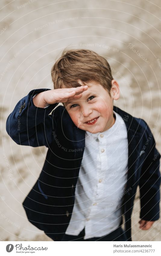 Happy blonde 3 years old boy in suit looking up 3 year old ahead background beautiful bright future business casual caucasian childhood cute education face