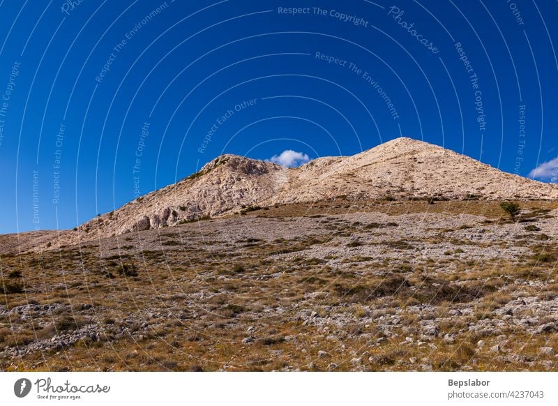 View of bare hills in Stara Baska mountain journey summertime croatia holiday nature road water background beach beautiful landscape sea travel view baska stara