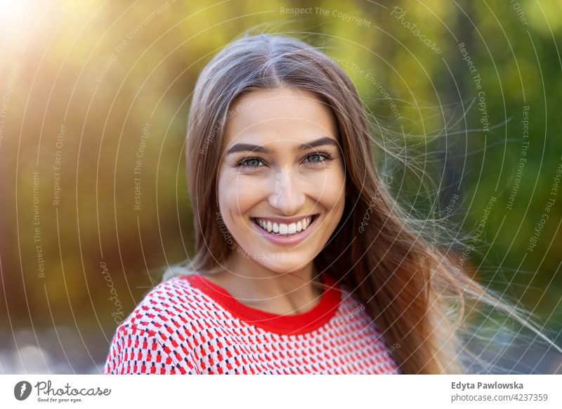 Portrait of young woman smiling outdoors enjoying lifestyle adult people one person casual caucasian positive carefree happy smile female attractive beautiful