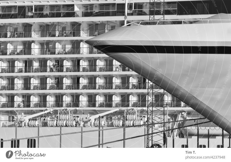 Two cruise ships in port Cruise harbor Harbour Bornholm Watercraft harbour water Industry Navigation bow travel Denmark b/w