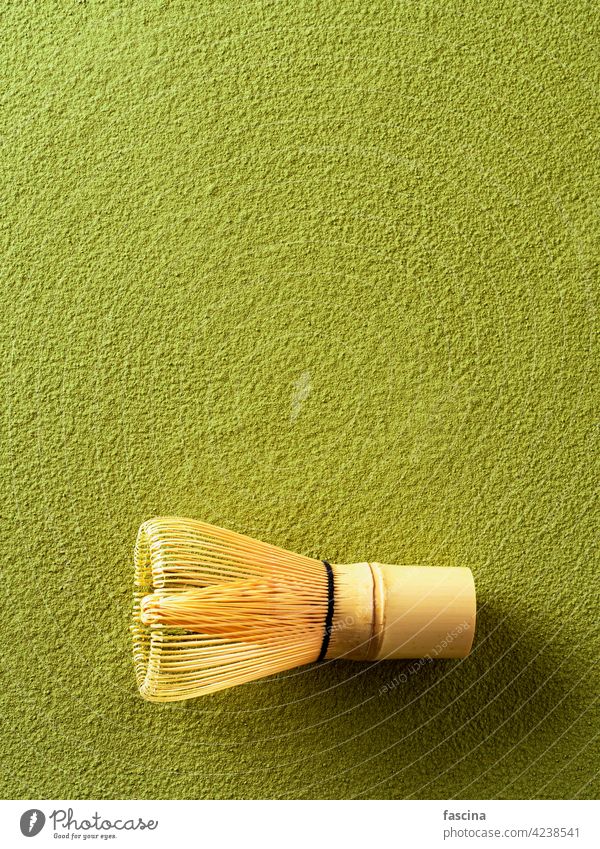 Powdered green tea Matcha and bamboo whisk white matcha background copy space top view vertical ceremony wooden chasen lifestyle traditional asian powder design