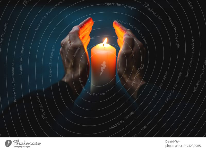 Warming hands on a candle shoulder stand warm sb./sth. Candlelight Cold Winter Candle flame Christmas & Advent Burn Illuminate Grief